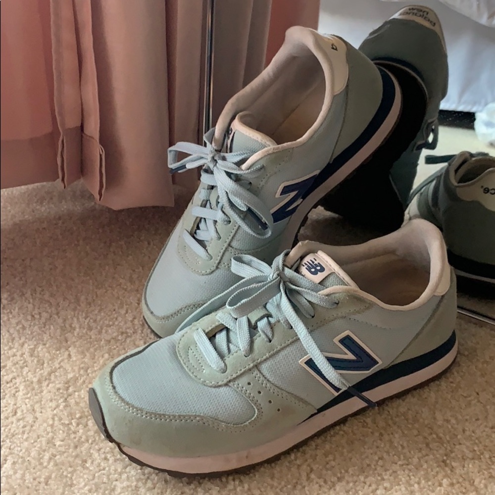New Balance 311 light teal tennis shoes